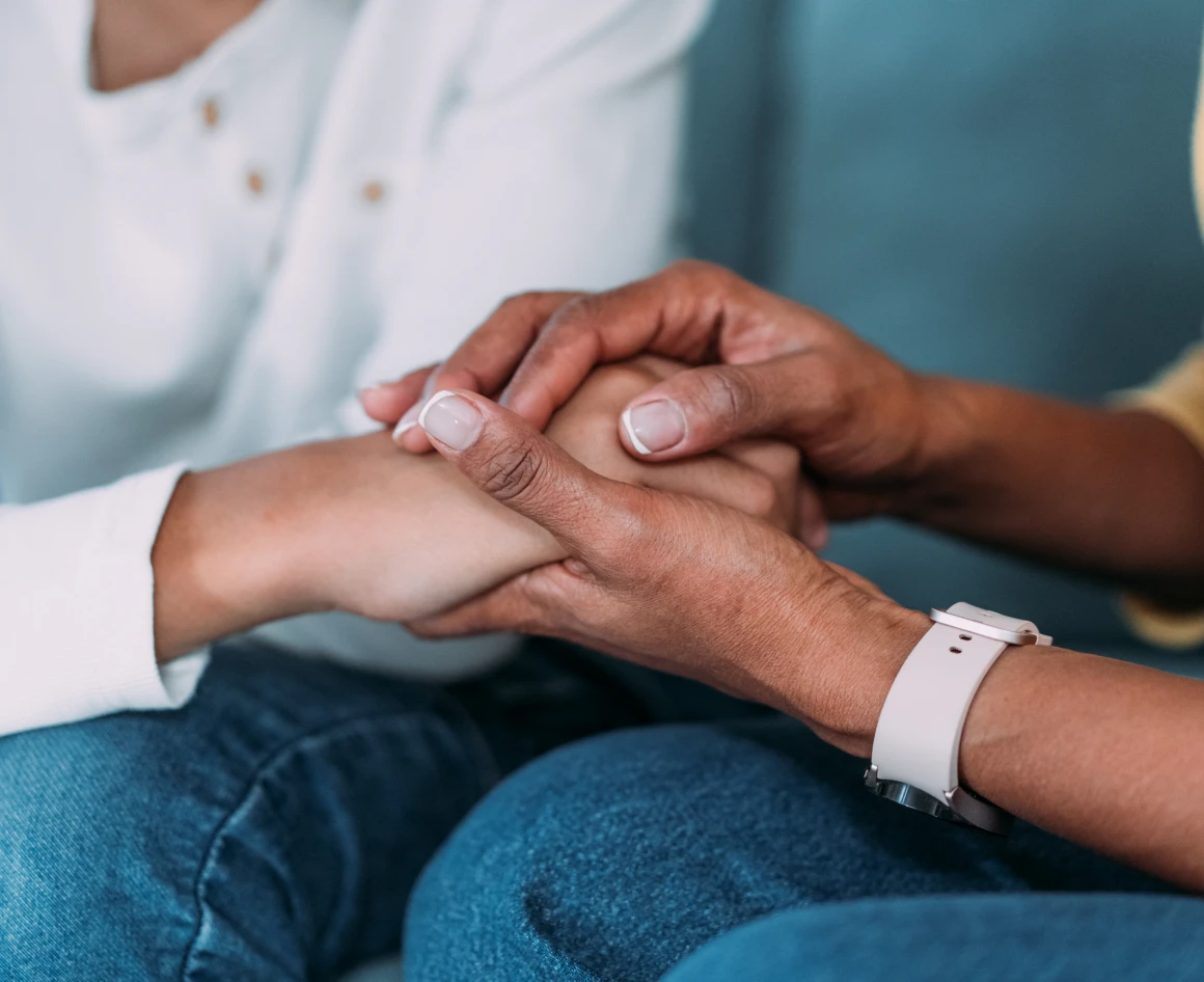 Hands offering comfort and support