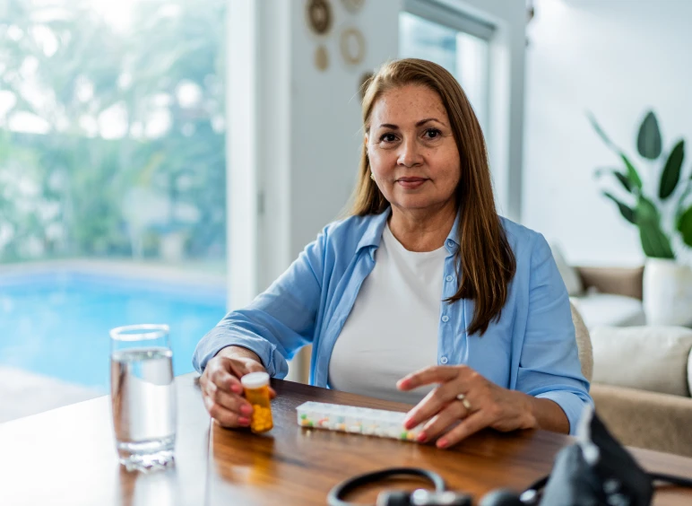 Woman organizing medication at home