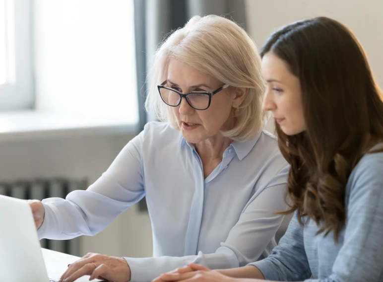 Two women collaborating at a desk